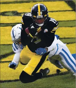  ?? DON WRIGHT – THE ASSOCIATED PRESS ?? Steelers wide receiver JuJu Smith-Schuster catches the go-ahead touchdown as he’s defended by Colts free safety Julian Blackmon midway through the fourth quarter.