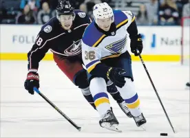  ?? PAUL VERNON THE ASSOCIATED PRESS ?? If Robert Thomas, right, plays fewer than 10 NHL games, he could return to junior hockey in Hamilton this season without the St. Louis Blues burning a year of his contract.