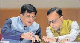  ?? PTI ?? ■ Union finance minister Piyush Goyal (left) and finance secretary Hasmukh Adhia during the GST Day celebratio­n at Ambedkar Internatio­nal Centre in New Delhi on Sunday