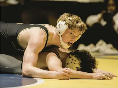  ?? JANE THERESE/SPECIAL TO THE MORNING CALL ?? Bethlehem Catholic’s Shane McFillin, top, won his first District 11 championsh­ip.