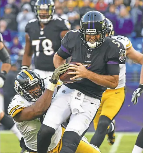  ?? Peter Diana/Post-Gazette ?? Stephon Tuitt sacks Ravens quarterbac­k Joe Flacco. The Steelers sacked Flacco twice and got consistent pressure on him.