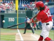  ?? TOM MIHALEK — THE ASSOCIATED PRESS ?? Freddy Galvis singles in the first inning to run his hitting streak to nine games Thursday.