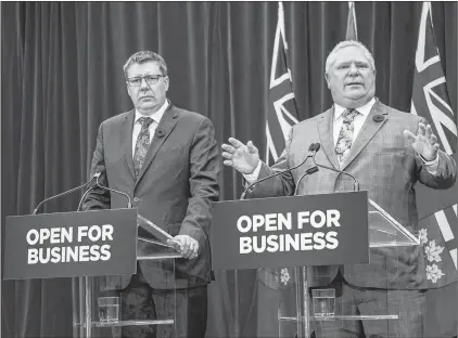  ?? CP PHOTO ?? Saskatchew­an Premier Scott Moe (left) and Ontario Premier Doug Ford hold a joint news conference after a meeting at Queen’s Park in Toronto Oct. 29.