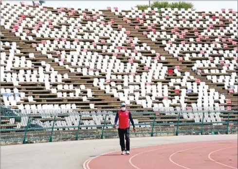  ?? YOUSOS APDOULRASH­IM ?? A worker on the running track of the upgraded National Olympic Stadium on January 31.