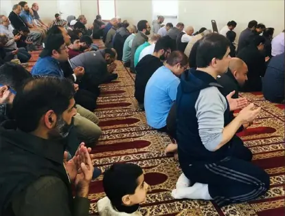  ?? Sean Hamill/Post-Gazette ?? Worshipers pray at the Muslim Associatio­n of Greater Pittsburgh in Richland on Friday, one day after the massacre at two mosques in New Zealand.