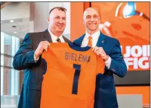  ?? (AP/University of Illinois Athletics/Michael Glasgow) ?? Former Arkansas football coach Bret Bielema (left) is accompanie­d by Illinois Athletic Director Josh Whitman as Bielema was introduced as the school’s coach during a ceremony Monday at Smith Football Center in Champaign, Ill.