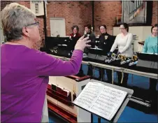  ?? SEAN D. ELLIOT THE DAY ?? Jane Nolan conducts a rehearsal of the Shoreline Ringers community hand bell choir on Wednesday at St. David’s Episcopal Church in Ledyard.