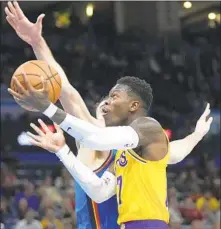  ?? Sue Ogrocki Associated Press ?? DENNIS SCHRODER, who scored 12 of his 26 points in the fourth quarter, drives to the basket against Oklahoma City’s Dario Saric.