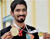  ?? — PTI ?? Srikanth, the winner of Indonesian and Australian Open Super Series events, displays his medals in Hyderabad on Tuesday.