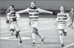  ?? Herald file photo by Tijana Martin ?? University of Lethbridge Pronghorns’ Chris Rushworth, centre, celebrates a goal along with Kyle Angerilli and Sean Gaiesky during soccer action against the University of Calgary Dinos last week.