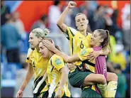  ?? AP/CLAUDE PARIS ?? Australia’s Chloe Logarzo (top) celebrates with teammates after a 3-2 victory over Brazil in the Women’s World Cup on Friday at Stade de la Mosson in Montpellie­r, France. Chloe Logarzo tied the score at 2-2 in the 58th minute before an own goal gave Australia the victory.