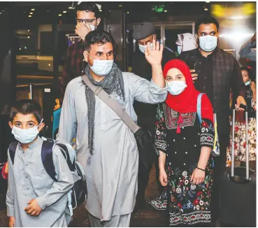  ?? KARIM JAAFAR / AFP VIA GETTY IMAGES ?? Canadians were among 200 evacuees from Afghanista­n who arrived at Hamad Internatio­nal Airport in Qatar’s capital, Doha, on Thursday after fleeing Kabul.