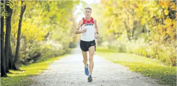  ?? BOB TYMCZYSZYN/POSTMEDIA NEWS ?? Fonthill resident Stuart Galloway goes for a run along a pathway this past weekend. The 56-year-old long-time runner won the full marathon at the Niagara Falls Internatio­nal Marathon earlier this month.