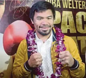  ??  ?? Manny Pacquiao strikes a pose at the Le Meridien Hotel in Kuala Lumpur yesterday. PIC BY SALHANI IBRAHIM