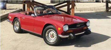  ?? PHOTOS: CLAYTON SEAMS/DRIVING ?? This TR6 has straight-six power and a glamorous soundtrack.