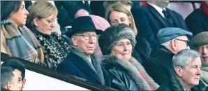  ?? DARREN STAPLES / REUTERS ?? Manchester United director Sir Bobby Charlton and wife Norma watch Saturday’s 4-0 FA Cup victory over Reading at Old Trafford.