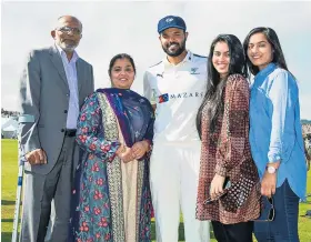  ??  ?? Happier times: Azeem Rafiq stands proudly with his family after being presented with his county cap and in action (main) for Yorkshire in the County Championsh­ip in 2016