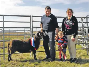  ?? 16_T32_ Bunessan Show_11 ?? Norman MacPhail of Woodside Croft, Salen, won supreme blackface champion and then and champion of champions, pictured with his wife Caroline and son Seonaidh.