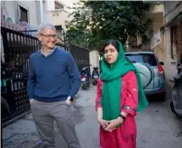  ?? Photo: Apple ?? Tim Cook and Malala Yousafzai outside the home of a family with daughters attending school in Beirut, Lebanon, supported by Malala Fund. —