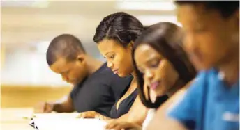  ??  ?? A cross section of African students in the library