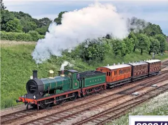  ?? JON BOWERS ?? An entirely Longhedge Works built train: SECR ‘C’ 0-6-0 No. 592 pulls away from Horsted Keynes on June 18 2016, with all three restored LCDR/SECR carriages.