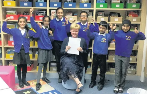  ??  ?? Hyndburn Park primary school headteache­r Wendy Tracey with pupils celebratin­g their recent ‘good’ Ofsted inspection