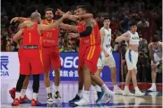  ?? — AP ?? Spanish players celebrate after defeating Argentina in the FIBA Basketball World Cup final in Beijing on Sunday.