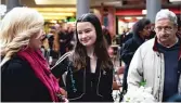  ?? ASHLEE REZIN/SUN-TIMES ?? Grace Bauer, 14, daughter of Chicago Police Cmdr. Paul Bauer, greets family members and supporters after a memorial service for her father at the Thompson Center Wednesday.