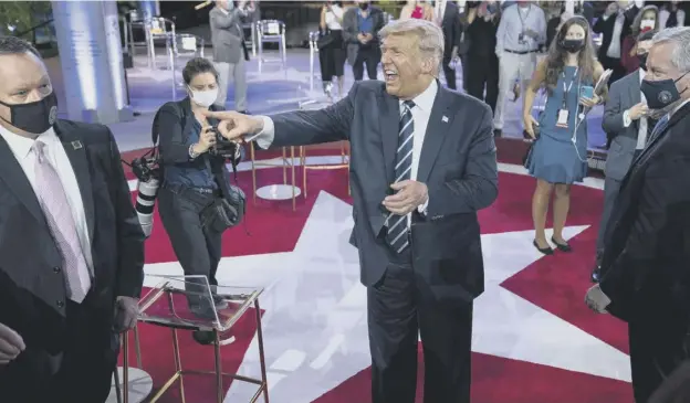  ??  ?? 0 President Donald Trump talks with voters after an NBC News Town Hall event at Perez Art Museum in Miami