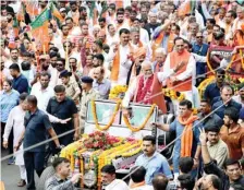  ?? ?? Union Minister Parshottam Rupala with former Gujarat CM Vijay Rupani during a road-show in Rajkot on Tuesday.