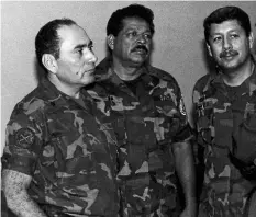  ?? THE ASSOCIATED PRESS FILES ?? Salvadoran ex-col. Inocente Orlando Montano Morales, centre, is seen above in July 1989. Morales faces extraditio­n from the U.S. to face charges he planned the murder of six Jesuit priests during El Salvador’s civil war.