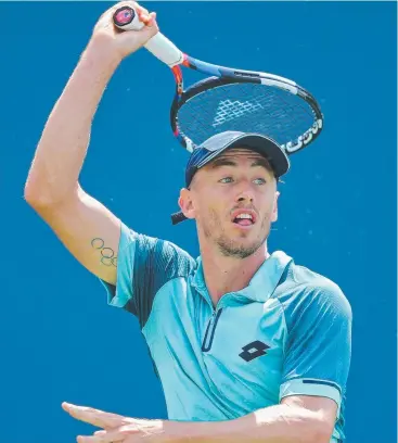  ??  ?? PAY DAY: John Millman of Australia in action against Malek Jaziri of Tunisia. Picture: GETTY