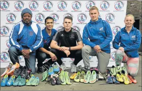  ??  ?? A NET GAIN: From left, Vuyo Zambodla, Darian Hendricks, Lasse Voges, Johannes Felsner and Johanna Luhmanna pose with the soccer boots organised by Voges which were handed over at North End Stadium