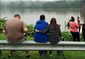  ?? Darrell Sapp/Post-Gazette ?? Family and friends of Jason Moore’s gather Thursday morning at the boat launch area in Monaca, waiting for crews to resume their search.