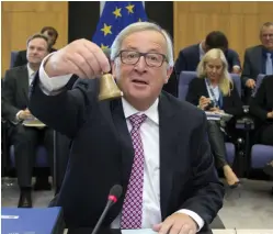  ??  ?? European Commission President Jean-Claude Juncker rings a bell to begin a meeting of the College of Commission­ers at EU headquarte­rs in Brussels. A draft law is intended to toughen EU financial rules. (AP)