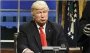  ?? WILL HEATH — NBC VIA AP, FILE ?? This file photo released by NBC shows Alec Baldwin portraying President Donald Trump in the opening sketch of “Saturday Night Live,” in New York. Baldwin doesn’t expect to take his impression of President Trump from “Saturday Night Live” to the annual...