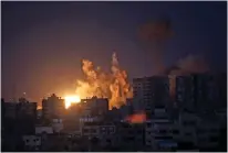  ?? /Getty Images ?? An explosion at a residentia­l tower caused by Israeli bombing raids in the north of Gaza Strip.