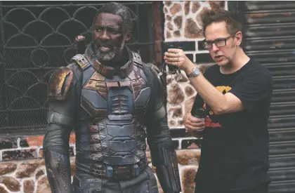  ?? PHOTOS: WARNER BROS./DC COMICS ?? Writer-director James Gunn, right, is putting his own spin on The Suicide Squad, which features Idris Elba, left.