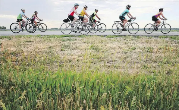  ?? AP/ANDREW CARPENEAN PHOTO ?? Cyclists head out on Hwy. 281 to start their ride during the 2017 Tour de Nebraska Wednesday, June 21, 2017.