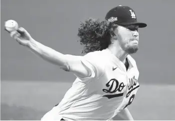  ?? TONY GUTIERREZ AP ?? Dodgers right-hander Dustin May earned the victory against the Padres in Game 1 of the NL Division Series. That two-inning stint would not preclude him from pitching tonight, said L.A. manager Dave Roberts.