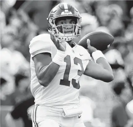  ?? STREETER LECKA/GETTY-AFP ?? Alabama quarterbac­k Tua Tagovailoa threw a career-high five touchdown passes Saturday against South Carolina.