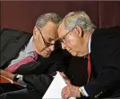  ?? AP ?? Senate Minority Leader Charles Schumer, D-N.Y., (left) speaks with Senate Majority Leader Mitch McConnell, R-Ky.