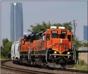  ?? SUE OGROCKI — THE ASSOCIATED PRESS FILE ?? A BNSF locomotive heads south out of Oklahoma City, Sept. 14, 2022. BNSF will become the second major freight railroad to allow some of its employees to report safety concerns anonymousl­y through a federal system without fear of discipline, the Federal Railroad Administra­tion announced April 25.