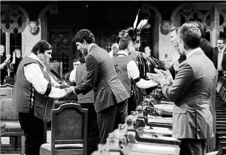  ?? SEAN KILPATRICK
THE CANADIAN PRESS ?? Prime Minister Justin Trudeau shakes hands with ceremony participan­ts after delivering a statement of exoneratio­n on behalf of the Government of Canada to the Tsilhqot'in Nation and the descendant­s of six Tsilhqot'in chiefs in the House of Commons on...