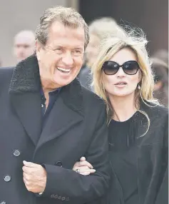  ??  ?? Testino (left) and model Kate Moss arrive for the Burberry Autumn/Winter 2015 collection show at London Fashion Week on Feb 23, 2015. — Reuters file photo