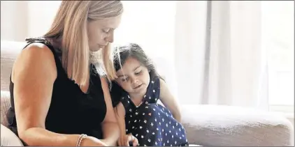  ?? ERIC ALBRECHT/DISPATCH ?? Antoinette Pratsinaki­s and her daughter Lucy, 4, read together at their Hillard home July 31. USA Today released a big report on maternal death and injury in the country, much of it focused on Central Ohioans. The US is the most dangerous place to give birth in the developed world, the report says, with over 50,000 mothers ending up severely injured during or after childbirth and 700 dying. Antoinette had a stroke following her delivery of Lucy and is still dealing with the fallout.