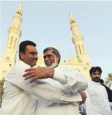  ?? Pawan Singh / The National ?? Worshipper­s greet one another after Eid Al Adha prayers at Jumeirah Mosque in Dubai yesterday