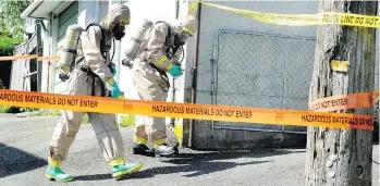  ?? NICK PROCAYLO ?? A HAZMAT team works in 2012 at 2906 Renfrew Ave., where items associated with the manufactur­e of meth, including Reactine pills, pipes used for smoking meth and baggies containing meth were found.