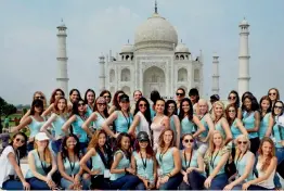  ?? — PTI ?? Models from 42 countries participat­ing in Face of Beauty Internatio­nal 2017 contest, pose in front of the Taj Mahal, in Agra on Monday.