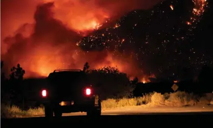  ?? Photograph: Canadian Press/Rex/Shuttersto­ck ?? A wildfire burns in Lytton, British Columbia, on 1 July as Canada and the north-western US suffered freakishly high temperatur­es.